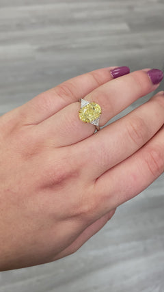 Fancy yellow diamond ring. Yellow diamond engagement ring. Canary diamond ring. Oval engagement ring. Fancy yellow diamond. Yellow diamond 3 stone ring. Fancy yellow. Oval diamond ring 