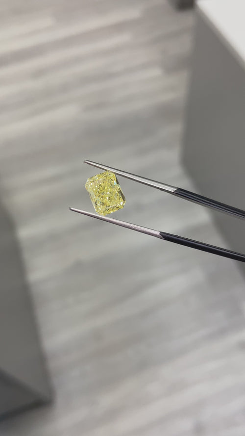 natural diamond. fancy colored diamond. yellow diamond. fancy intense yellow diamond. fancy intense yellow. fancy yellow diamond. yellow diamond radiant cut. radiant cut diamond.