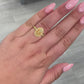 Light Yellow Oval diamond ring set in 18 karat yellow gold with yellow round diamonds.