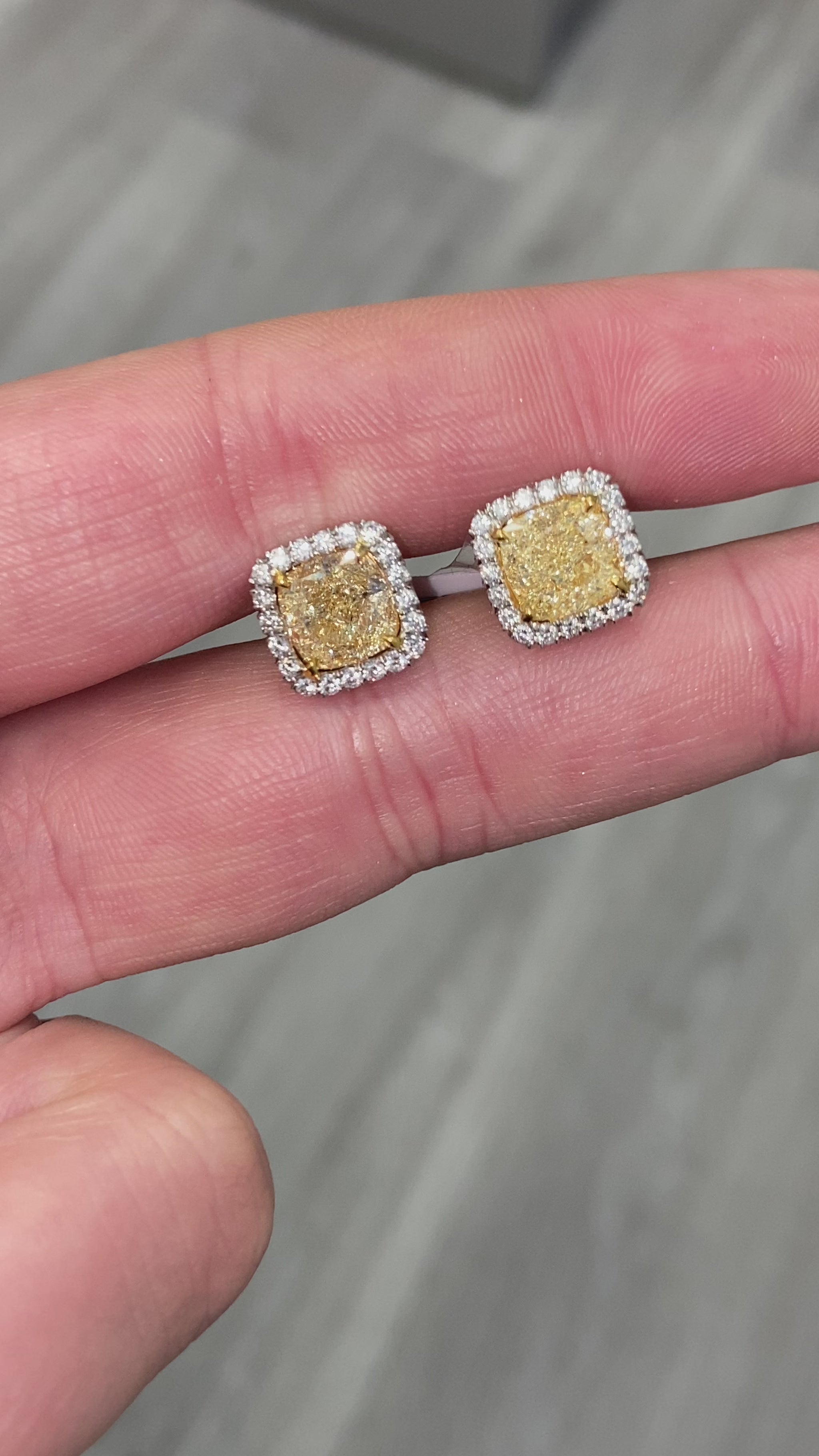 yellow diamond earrings. yellow diamond studs. yellow diamond halo studs. cushion cut yellow diamonds,