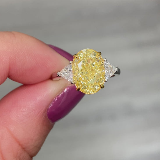 Fancy yellow diamond ring. Yellow diamond engagement ring. Canary diamond ring. Oval engagement ring. Fancy yellow diamond. Yellow diamond 3 stone ring. Fancy yellow. Oval diamond ring 