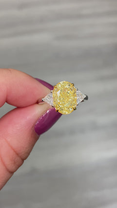 Fancy yellow diamond ring. Yellow diamond engagement ring. Canary diamond ring. Oval engagement ring. Fancy yellow diamond. Yellow diamond 3 stone ring. Fancy yellow. Oval diamond ring 