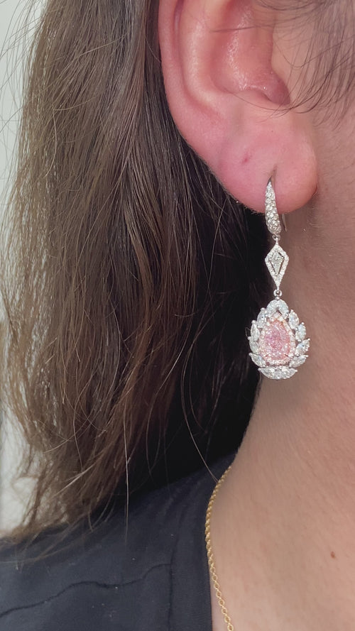 pink diamond earrings. pink diamonds. pink diamond jewelry. pink diamond studs. pink diamond drop earrings. pink and white diamond earrings. pink diamond pear shaoes.