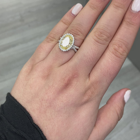 yellow diamond oval ring. yellow diamond halo ring. 4 carat yellow ring. oval yellow diamond. yellow diamond oval shape.