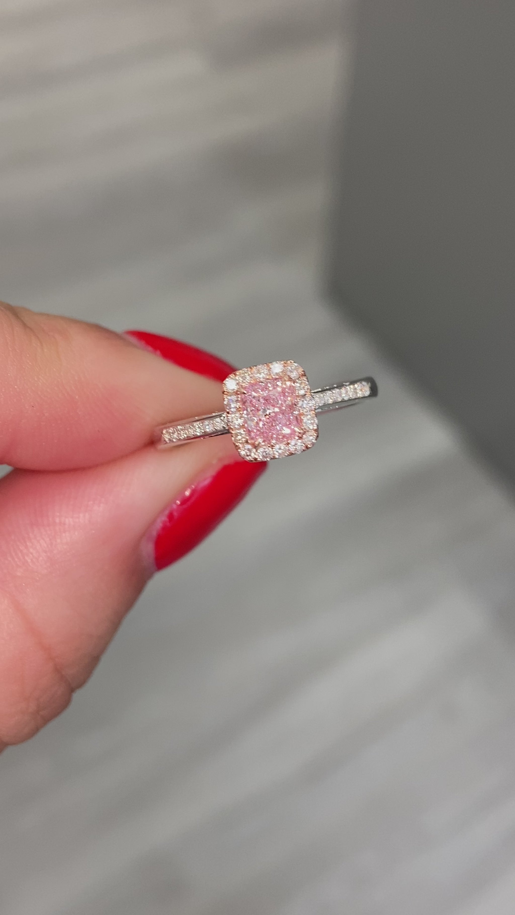 Pink diamond ring. pink diamond engagement ring. light pink diamonds. light pink cushions. diamond ring.