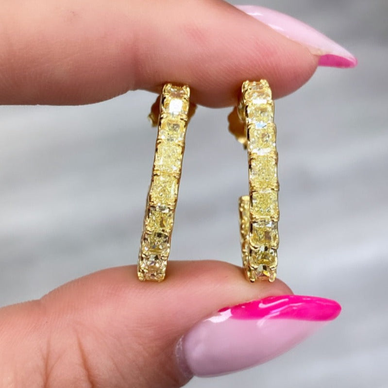 Yellow diamond hoops. Diamond hoop earrings. Yellow diamond earrings. Yellow diamond jewelry. Yellow diamond radiant cut.