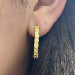 Yellow diamond hoops. Diamond hoop earrings. Yellow diamond earrings. Yellow diamond jewelry. Yellow diamond radiant cut.