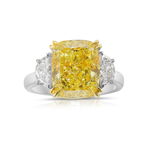 Elegant yellow diamond ring with a cushion-cut fancy yellow diamond and VS1 clarity.