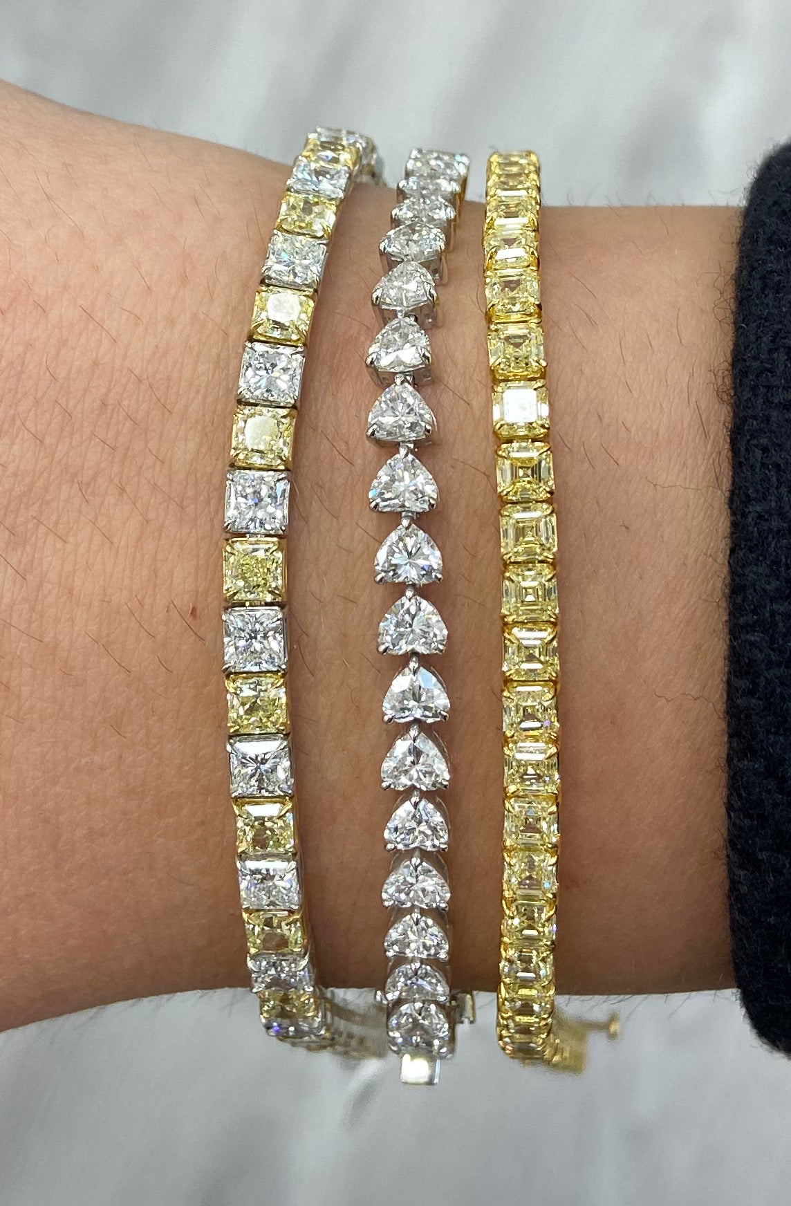 Alternating yellow and white diamond bracelet. tennis bracelet. alternating diamond bracelet. yellow diamond cushions.