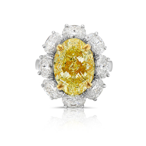 Fancy light yellow oval diamond. 7 carat yellow diamond oval shaped.