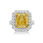 Elegant light yellow diamond engagement ring featuring a radiant cut with VS1 clarity.