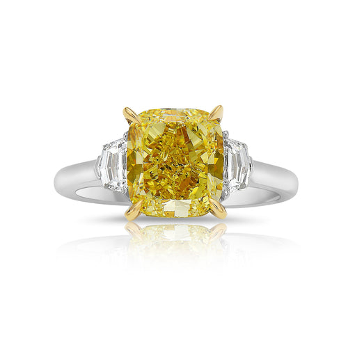 Yellow cushion-cut diamond ring with VS1 clarity, GIA certified, set in an elegant design.