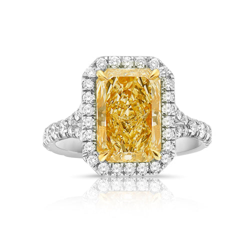 Royal light yellow elongated radiant diamond ring. Light yellow diamond. Yellow diamond engagement ring. Yellow diamond jewelry. Gia certified yellow diamonds.