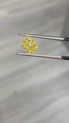 fancy intense yellow diamond. natural diamond. fancy colored diamond. yellow diamond. long radiant diamond. long radiant. long radiant intense yellow. 