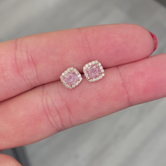 Pink diamond earrings. pink diamond studs. light pink diamonds. light pink cushions. diamond earrings.