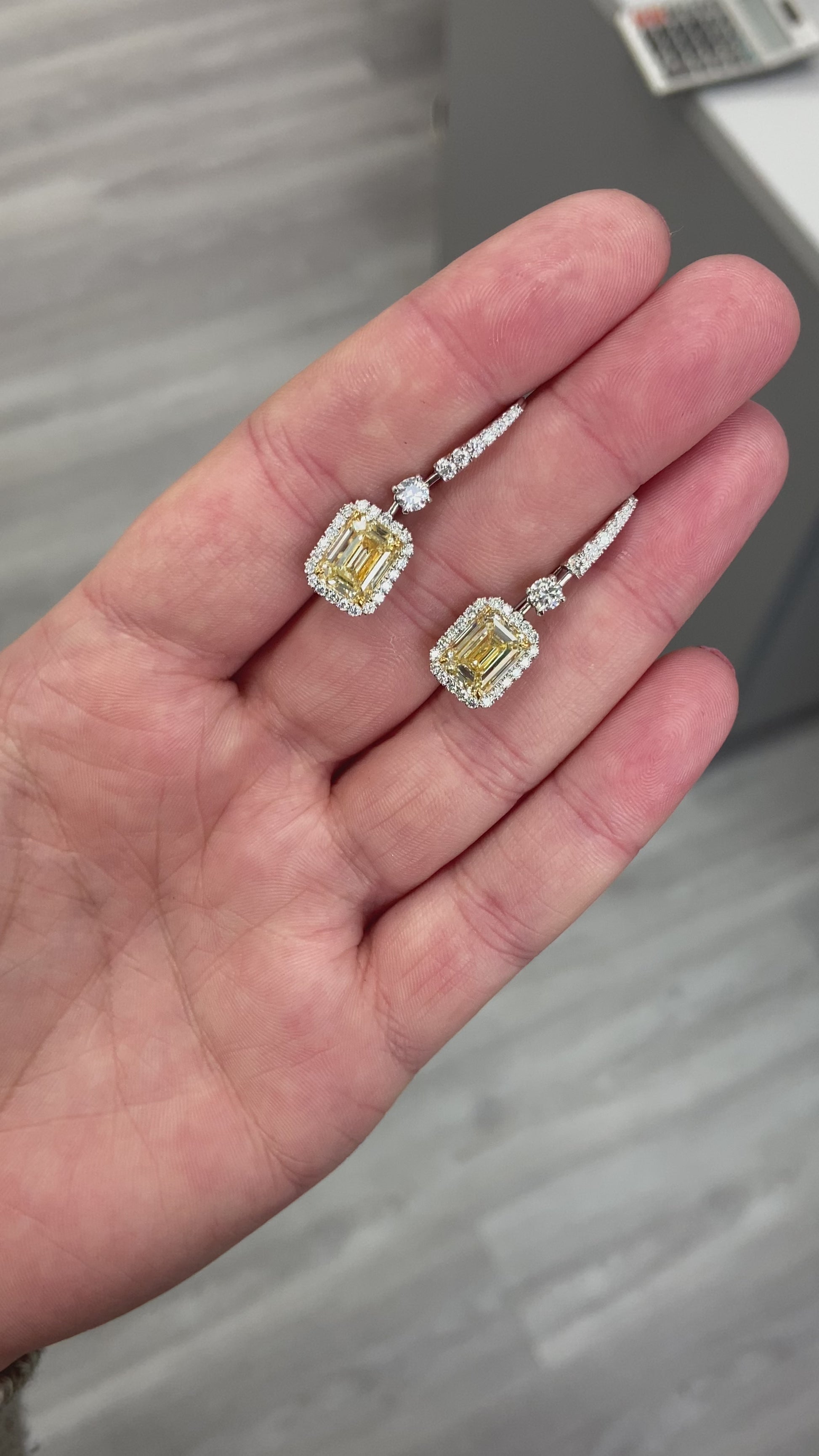 Yellow diamond studs. Yellow diamond earrings. Cushion cut diamond earrings. Yellow diamond earrings. Canary yellow diamond earrings. yellow diamond emerald cut.