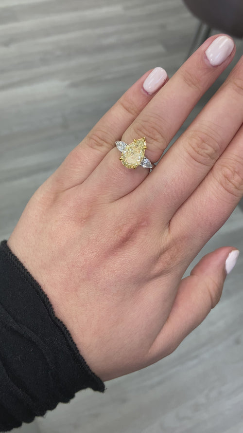 yellow diamond ring. yellow diamond pear shape. yellow diamonds. fancy yellow pear shape.