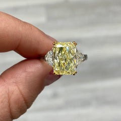 Fancy light yellow elongated radiant cut diamond ring