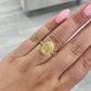 Light Yellow Oval diamond ring set in 18 karat yellow gold with yellow round diamonds.