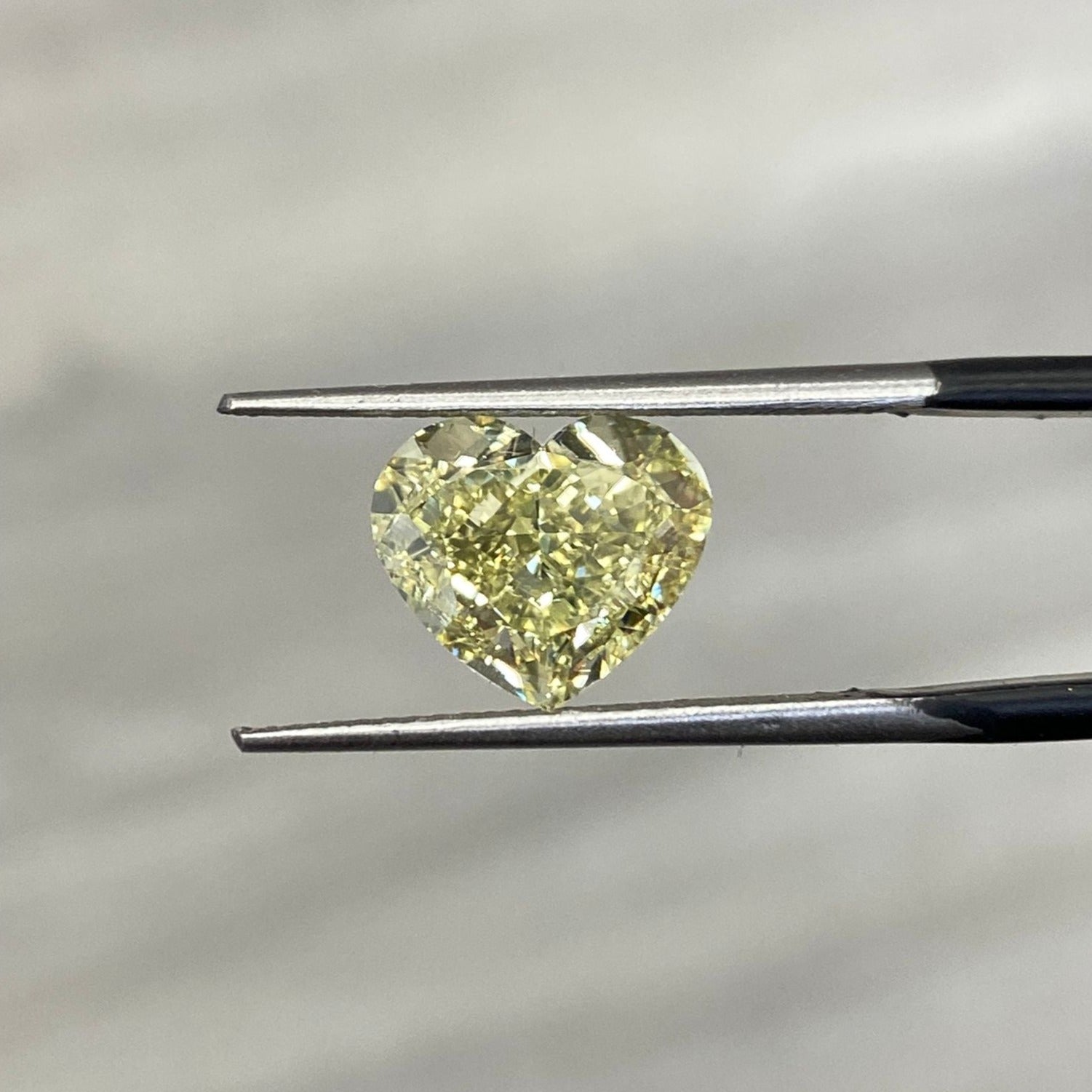 natural diamond. fancy colored diamond. yellow diamond. yellow heart diamond. fancy yellow diamond. yellow diamond heart shape.