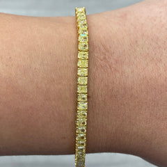 Fancy yellow diamond bracelet. Cushion diamond bracelet. Cushion tennis bracelet. Yellow diamond jewelry. Yellow tennis bracelet. Natural yellow diamonds;