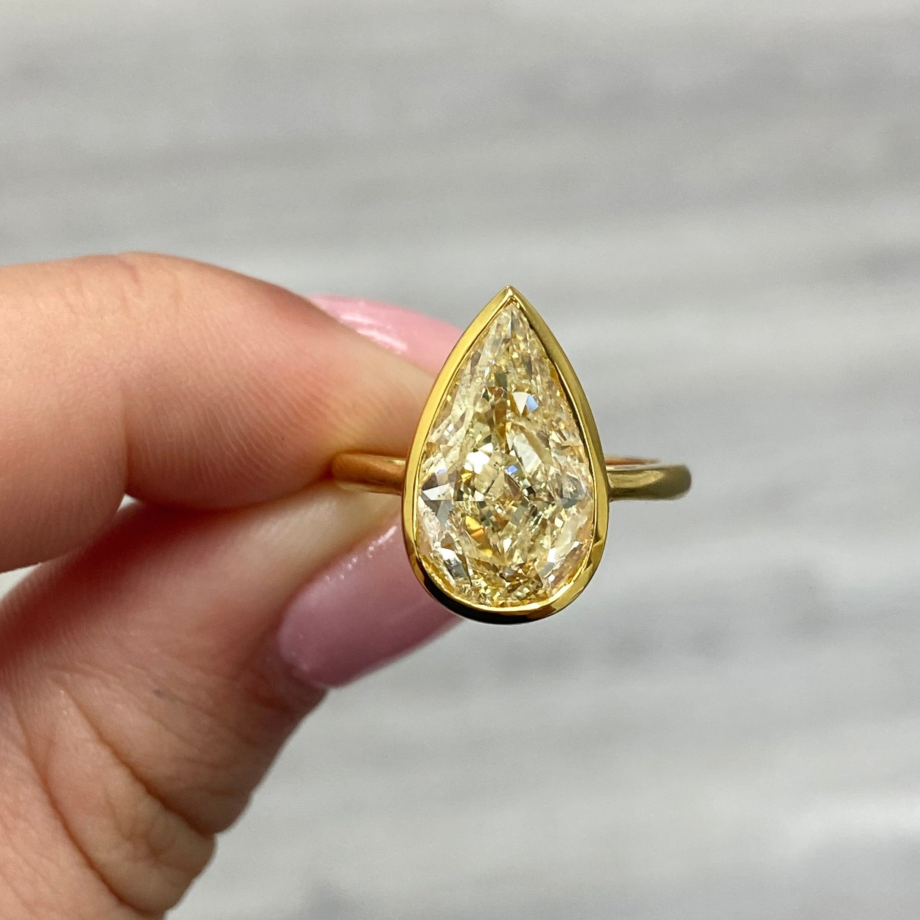 5.02ct GIA Light Yellow Pear Diamond Ring