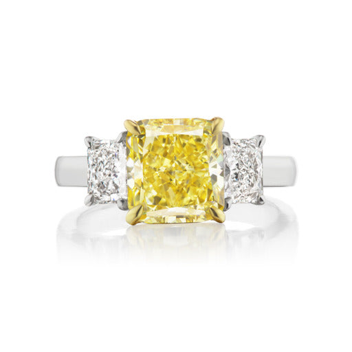 3.52ct GIA Fancy Intense Yellow VS2, set in platinum with 0.80cts D color radiants