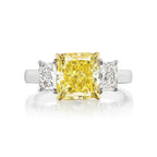 3.52ct GIA Fancy Intense Yellow VS2, set in platinum with 0.80cts D color radiants